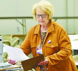 POLL WORKER MARLENE CASPERSEN helped man the polling site at Boelus during the Tuesday, May 12th primary election. Photo by Michael Happ