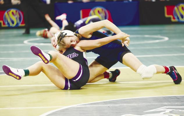 ALEXIS GALUSHA attempts to flip Battle Creek’s Ella Reeves during the opening round of last week’s NSAA State Girls Wrestling Championships in Omaha. Galusha was pinned in the first period in that match. Photo by Jeremy Vauble