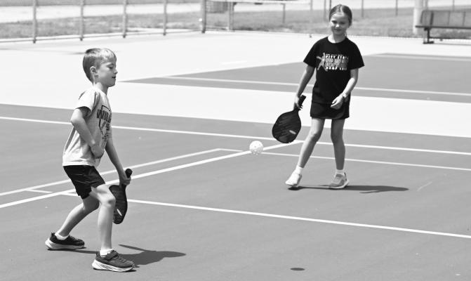 THE NEW TENNIS AND PICKLEBALL COURTS near Grover Cleveland Alexander Field officially opened to the public on Tuesday, June 16th. The courts were part of numerous park improvements in the city paid for via an $875,000 award from the Nebraska Department of Economic Development’s Rural Community Recovery Program. Pictured above, Jack and Lainey Meyer enjoy a game of pickleball on opening day.