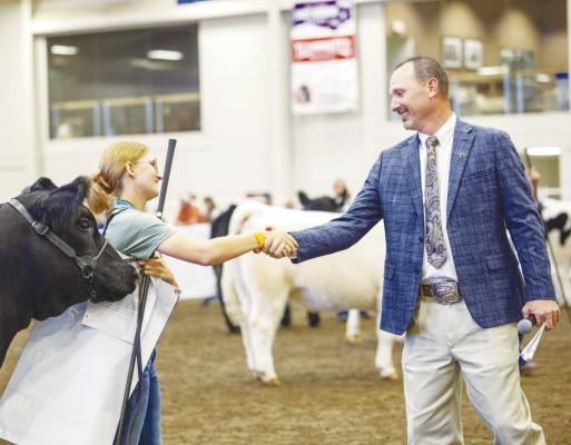 JALEE HAGGERTY shakes the hand of judge Ryan Rathmann after being named the FFA Junior Beef Showmanship Grand Champion at the 2025 Nebraska State Fair. Courtesy Photo