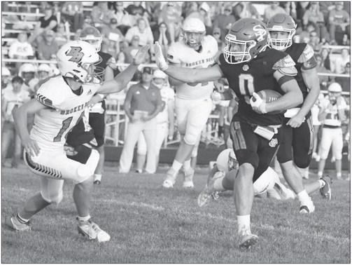 ST. PAUL’S GAGE SACK skirts past a Broken Bow defender on his way to the end zone during the first quarter of Friday night’s game between the Wildcats and the Indians. Photos by Michael Happ
