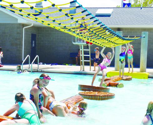 KIDS OF ALL AGES enjoyed the refurbished floaties at the St. Paul Water Park last Thursday. The park opened to the public on May 25th, after cool weather caused the facility to be closed on its anticipated opening date, May 24th. Photos by Michael Rother