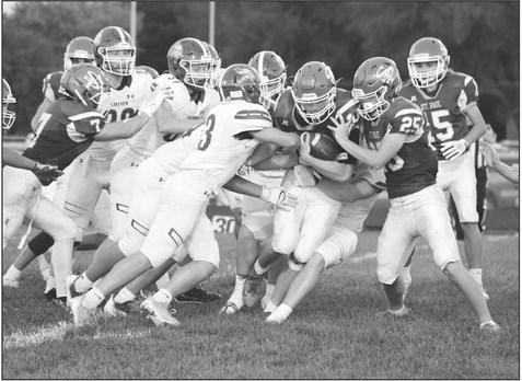 ST. PAUL senior John Placke fights for yards during the second quarter of Friday night’s game between the Wildcats and Columbus Lakeview. Placke had nine carries for thirty-two yards in the game. (Michael Happ)