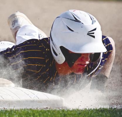POST 119’S COLBY WOOD avoids getting picked off first base during last Thursday’s game against Hartington. Photos by Michael Happ