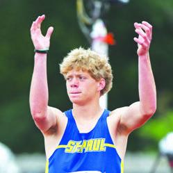 ST. PAUL’S CONNER DOUTHIT works to get the crowd cheering for him during the boys’ triple jump on Friday morning. Photos by Jordan Coslor and Michael Happ