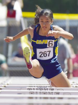 ZAYA LEWIS qualified for the NSAA Class C State Track and Field Championships in three events last week. Lewis placed eleventh in the 100-meter-high hurdles (above) on Friday. The freshman recorded a time of 15.83.