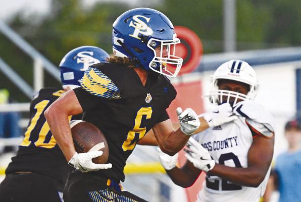 ST. PAUL’S ZANDYN WELLER returned a punt seventy-seven yards to help set up the Wildcats’ first touchdown of last Friday night’s game against Cross County. The Wildcats defeated the Cougars 31-16. Photos by Michael Happ