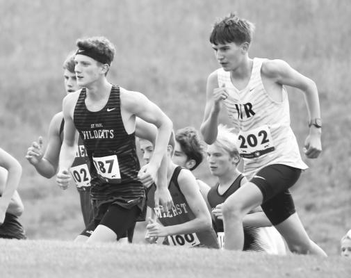 ST. PAUL JUNIOR AIDEN LUKASIEWICZ crests a hill during the boys’ race at the Ron Priebe Invitational hosted by Gibbon High School. Lukasiewicz led the boys’ team at the Buffaloes’ meet. Photos by Jordan Coslor