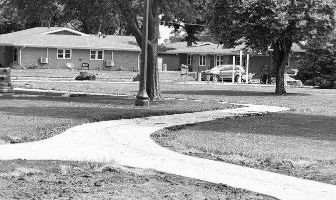 Courtesy Photo THE FINISHING TOUCHES are being put on the St. Paul City Park ahead of GCA Days. New sidewalks have been completed and sod is being laid. The improvements are part of numerous park improvements in the city paid for via an $875,000 award from the Nebraska Department of Economic Development’s Rural Community Recovery Program.