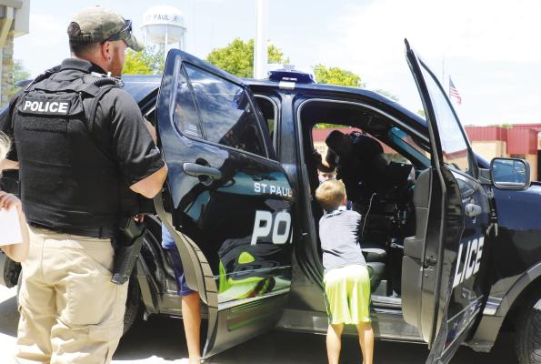 PARTICIPANTS in the St. Paul Summer Recreation Program enjoyed the opportunity to check out one of the city’s police cruisers following a special presentation by St. Paul Chief of Police Dan Howard on Monday. Michael Rother
