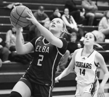 ADDISON WYSOCKI drives into the lane during Elba’s game against Central Valley during the semifinals of the Goldenrod Conference Tournament last week in Greeley. Photos Jordan Coslor
