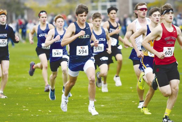 ST. PAUL sophomore Eli Sladek battles for position at the start of last Friday’s NSAA Class C State Cross Country Championships at the Kearney Country Club. Sladek placed eighty-second at the state meet. Photos by Michael Happ