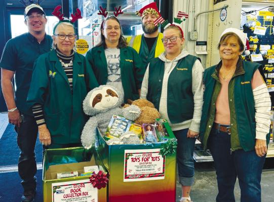 BOMGAARS employees pictured with some of the toys collected include Michael Sack, Linda Peer, Leanne Priest, Josh Reimers, Shelby Dvorak, and Jackie Brownlee. Courtesy Photo