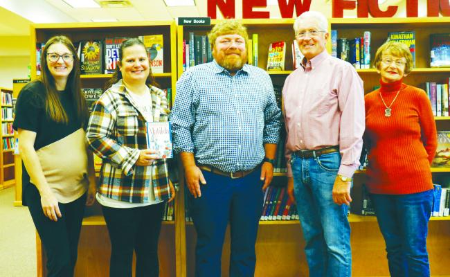 THE ST. PAUL LIBRARY FOUNDATION recently made a $2,170.50 donation to St. Paul Elementary School. Pictured at the check presentation last Wednesday at the St. Paul Library are St. Paul Library Director Kelli Helton, Third Grade Teacher Stephanie Palacz, St. Paul Elementary Principal Alex Egger, St. Paul Library Foundation President Fred Meyer, and Acting St. Paul Library Foundation Treasurer Velda Peters. Photo by Michael Rother