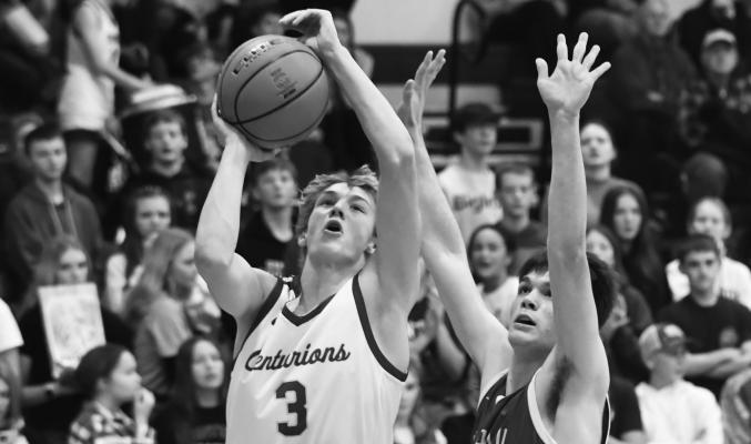 CENTURA SOPHOMORE Jakob Ruhl goes up for a bucket during last Tuesday’s game between St. Paul and Centura. Ruhl had eleven points in the contest. (Jordan Coslor)