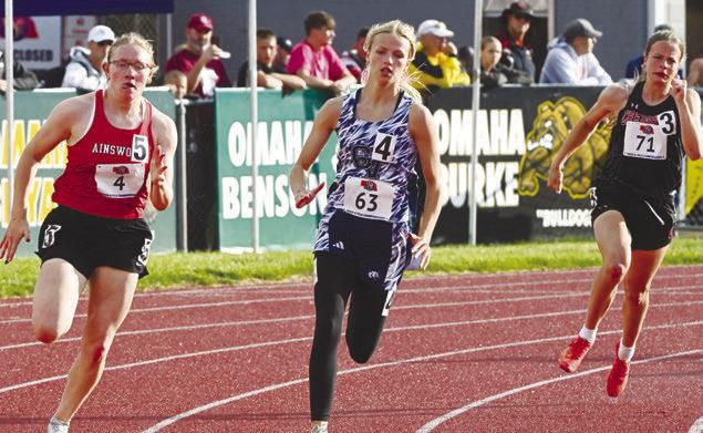 TAYLOR MCINTYRE makes the turn during the prelims of the 200-meter dash during the Friday session of the