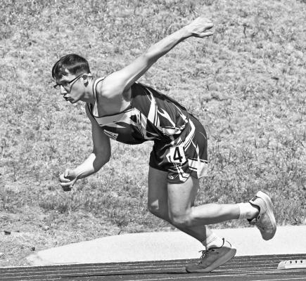 ELBA’S BLAKE BARG blows out of the blocks at the start of last week’s 400-meter dash in Loup City. Barg finished the quarter-mile race in 1:01.61 to place seventeenth in a field of almost thirty runners. Photos by Michael Happ
