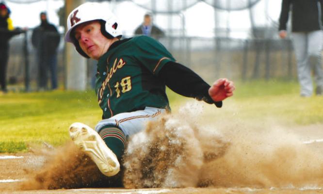 CENTRAL CITY/CENTURA’S DYLAN FLEMING slides into home during the Kernels’ game against Hastings last Tuesday night. The Kernels fell to the Tigers 11-4. Photos by Jordan Coslor