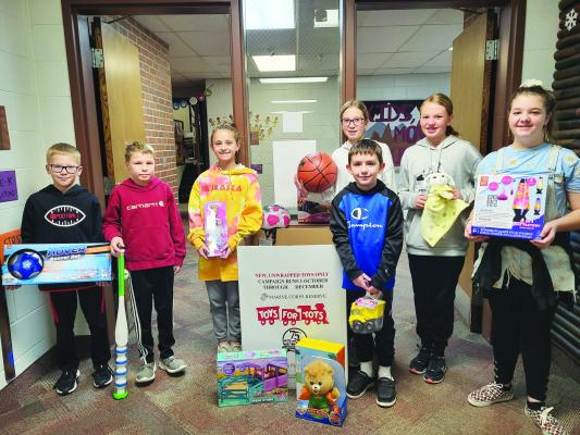 CENTURA ELEMENTARY students who helped with this year’s Toys for Tots drive included (front row): Ryan Panowicz, Konnor Knopik, Macyn Cron, and Ryker Merithew; (back row): Adalyn Bierhaus, Allie Becker, and Dalila Hardenbrook. (Courtesy Photo)