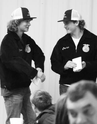 THE ST. PAUL FFA CHAPTER held its annual FFA Labor Auction last Thursday at the Howard County Fairgrounds in St. Paul. At top, St. Paul FFA members Kingston Sack and Gage Sack wait patiently for their turn on the auction block last week. Below, Brooke Peetz and Norah Paulsen wait for their turn in front of the crowd. Photos by Michael Happ