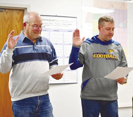 ST. PAUL’S new city councilmembers—Jerry Woodgate and Mark Wilson—take the oath of office during last Monday night’s meeting. Photo by Michael Happ