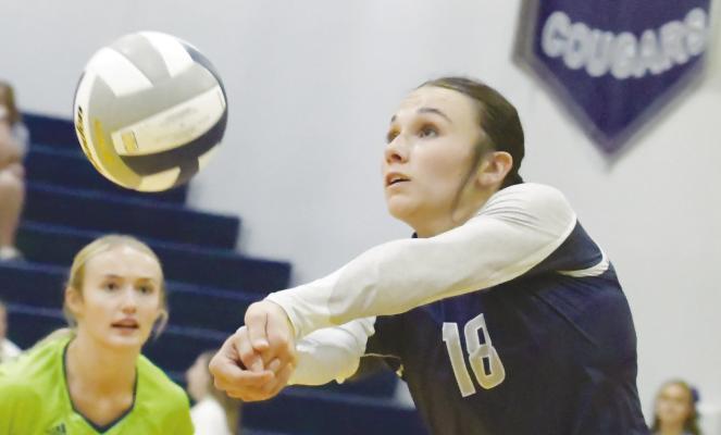 CENTRAL VALLEY’S Callie Wadas digs up a shot from Pleasanton during last Thursday night’s match between the Cougars and the Bulldogs. Central Valley swept Pleasanton for their ninth win of the season. Photos by Michael Happ