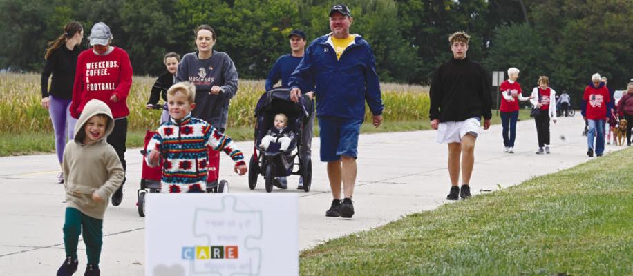 THE ST. PAUL CARE TEAM’S fourth annual Mental Health Mile event attracted participants of all ages on Sunday afternoon. Above, walkers make their way up Taylor Street during the first leg of the walk. Photos by Michael Happ