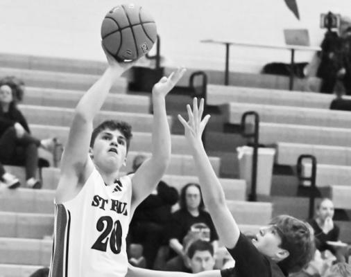 ST. PAUL senior Beau Paro puts up a shot from the corner during the first quarter of last Thursday night’s game against Wood River. Paro made three triples in the first quarter of last week’s game. Photos by Michael Happ