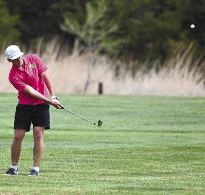 ST. PAUL’S BEAU PARO shoots on to the second green at the St. Paul Country Club during last week’s St. Paul Invite. Paro won the individual title at the Wildcats’ meet. Photo by Michael Happ