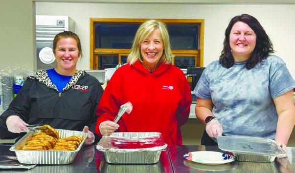 ST. PAUL ROTARIANS who lent a hand with Hot Meals USA last Sunday included Kerin Smydra, Katie Mathews, and Jordan Bottolfson. Courtesy Photo