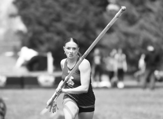 LAUREN SUNTYCH vaulted off the runway to win a gold medal in the girls’ pole vault at last week’s LouPlatte Conference track meet. Suntych cleared 10-02 for the hardware. Photos by Jordan Coslor
