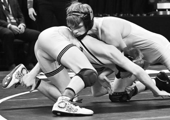 RYLAN RASMUSSEN went toe-to-toe with Philip Streff of North Bend Central during the gold-medal match at 120 pounds last week. Rasmussen ended up losing that match by a 4-1 decision. Photos by Michael Happ