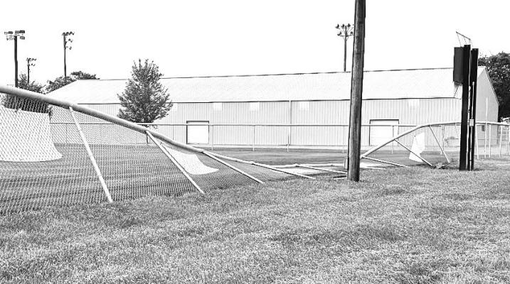 MOTHER NATURE packed a punch on Wednesday evening, as a series of severe thunderstorms passed through Howard County. As a part of the storm system, high winds caused widespread damage to trees and property, including to the outfield fence at one of the ballfields on the west side of St. Paul. Crews had the fence vertical shortly after last week’s storm, but portions will still need to be repair. Courtesy Photo