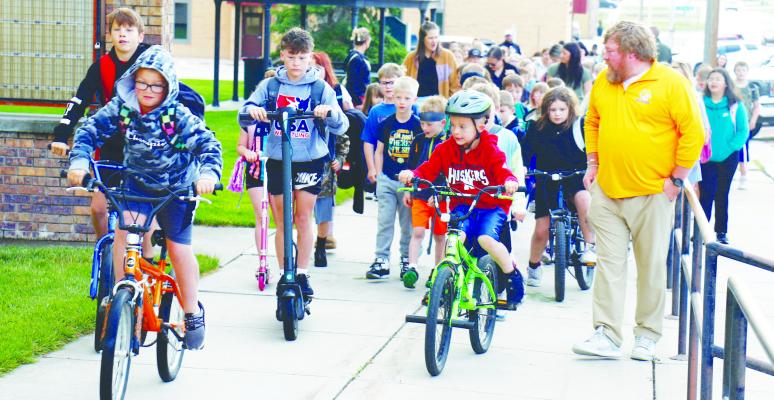 AROUND 100 STUDENTS from St. Paul Elementary School, as well as teachers and parents, participated in last Wednesday morning’s Walk to School Day. The annual event, which has become a hallmark of the end of the school year at St. Paul, began at the city park and traveled west to the school’s Howard Avenue campus. Photos by Michael Rother