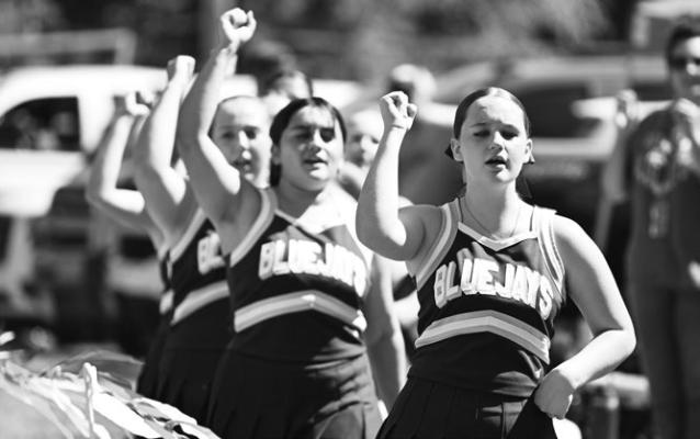 MEMBERS OF THE ELBA HIGH SCHOOL CHEERLEADING SQUAD were on hand on Friday afternoon to help the sideline crowd get fired up for the Bluejays’ season opener last week. Elba ended up falling in the game to High Plains Community Schools, 58-0. Photo by Michael Happ