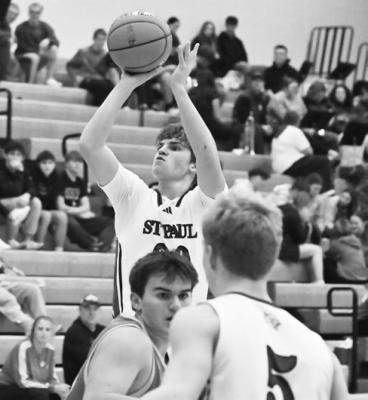 ST. PAUL’S BEAU PARO pulls up for a three-pointer during the first half of last week’s game against Columbus Scotus. Paro had a pair of three-pointers in the first quarter of the Wildcats’ battle against the Shamrocks. Photos by Michael Happ