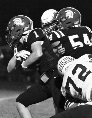 CENTURA’S Dylan Fleming attempts to shake free from a Wood River defender during last Thursday night’s game Photo by Michael Happ