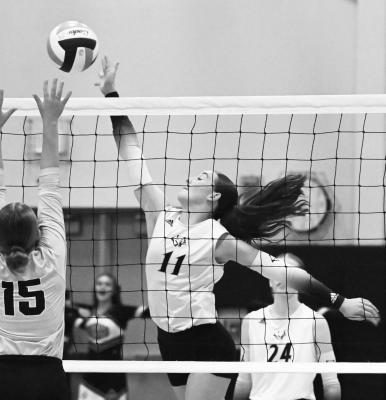 CENTRAL VALLEY sophomore Bentleigh Dugan goes for a kill during the second set of the Cougars’ match with the Ansley-Litchfield Spartans last Tuesday in Greeley. Dugan had a match-high nine kills against the Spartans. Photos by Michael Happ
