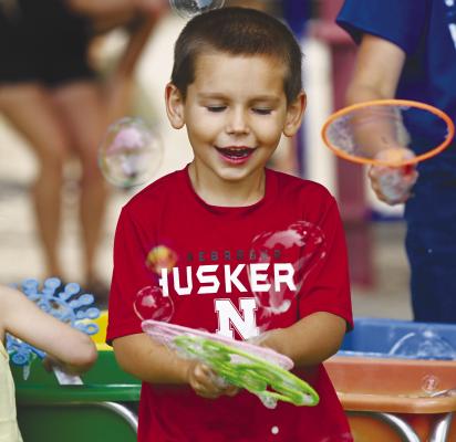 LANE MRKVICKA enjoyed playing with bubbles on Saturday during the kids’ games at Grover Cleveland Alexander Days.