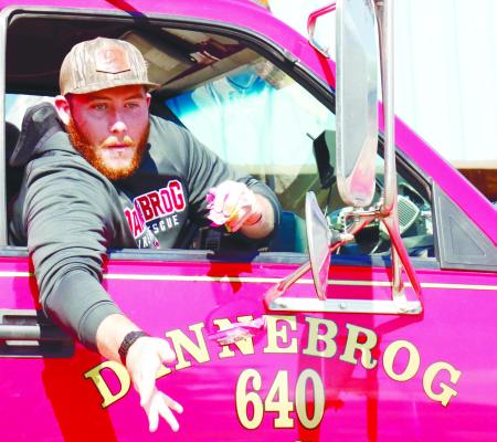 JUSTIN MOGUS threw out candy from one of Dannebrog Fire’s apparatus on Saturday. This year’s Grundlovsfest Parade featured a variety of emergency response vehicles, honoring the Dannebrog Fire Department’s anniversary.
