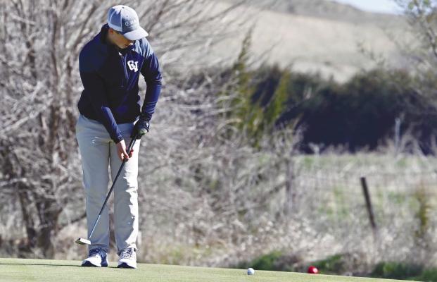 CENTRAL VALLEY’S Matthew Pribnow attempts to sink a putt on the fifth green at the Loup City Golf Course last week during the Rebels’ annual invite. Central Valley placed third at the five-team meet. Photos by Michael Happ
