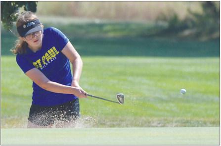 ABBY HIRSCHMAN chips on to the seventh green during last week’s St. Paul Quad at the St. Paul Country Club. Photo by Michael Happ
