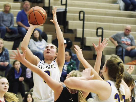 ST. PAUL senior Clara Kunze goes up for two points during the second quarter of Friday night’s game against Arcadia/ Loup City. The Wildcat had eight points in the game, which helped St. Paul to a 63-28 victory over the Rebels. (Michael Happ)