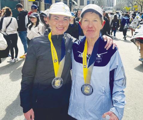 KACI LICKTEIG AND LORI LEONARD are pictured with the medals they received from running in the 129th Boston Marathon. Leonard is a resident of Dannebrog and Lickteig, a Centura High School graduate, lives in Omaha. Courtesy Photo