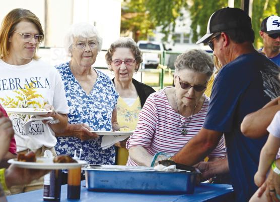 ORGANIZERS of the inaugural Dugout BBQ Challenge estimate that around 200 people attended Saturday night’s fundraiser in St. Paul. The event featured six teams participating in a barbecue competition. Photo by Michael Happ