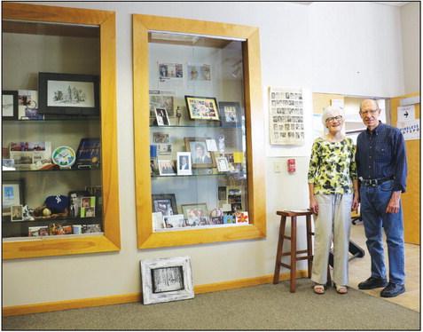 JOHN MCINTYRE’Sparents, Barb and Dan McIntyre of St. Paul, are pictured next to a display at the St. Paul Public Library honoring John’s life. A generous gift was made to the St. Paul Library Foundation thanks to numerous memorial donations that were received in the wake of John’s passing. (Michael Rother)