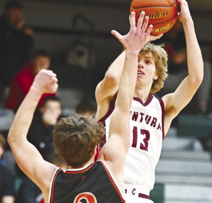 BARRETT FRIES rises above a Fort Calhoun defender during the semifinals of the Blizzard Blowout Holiday Tournament in Howells on Friday. Fries led Centura against the Pioneers with nineteen points. Photos by Michael Happ