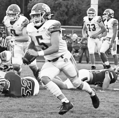 ST. PAUL’S MASON MAJERUS finds room to run on the Wildcats’ second series of last week’s game between St. Paul and Ord. The Chanticleers topped the Wildcats 49-12. Photo by Michael Happ