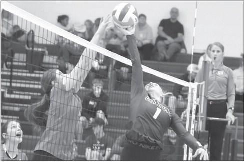 KYRA WOODEN tips the ball over the net during last Thursday’s match against Broken Bow. Photos by Michael Happ