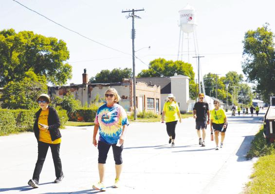 PARTICIPANTS IN THE CARE TEAM’S second annual Mental Health Mile are pictured making their way up 1st Street in Dannebrog on Sunday afternoon. Fifty-five individuals participated in this year’s event. Photos by Michael Rother
